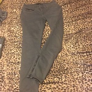 Gray jeans ankle length zippers on side at bottom
